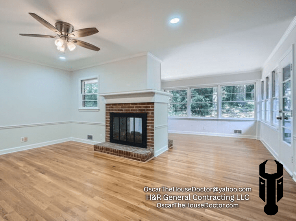 Open-concept living room update with restored real wood flooring and fresh interior paint.